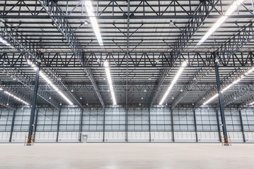 Empty warehouse. Factory building or warehouse building with concrete floor for industry.