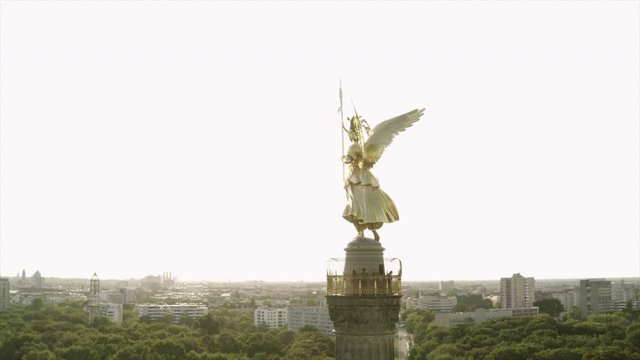 The Siegessaeule in Berlin in an aerial shot. The camera circles around the victory column with its "Goldelse" golden lizzy.