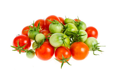 Small bunch of ripe red and green unripe tomatoes isolated on white background