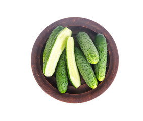 Fresh green cucumbers on ceramic bowl. Photo