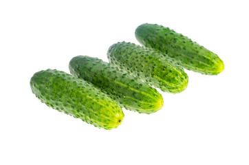 Bunch of fresh green cucumbers isolated on white background