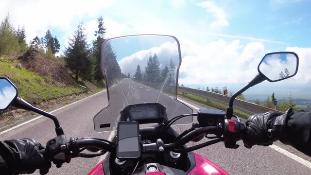 Motorcyclist Rides on a Beautiful Landscape Mountain Road in Slovakia. Serpentine Road