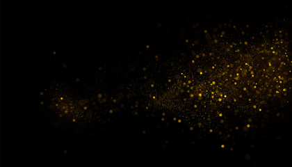 Golden glitter dust on black background