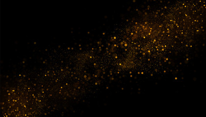 Golden glitter dust on black background