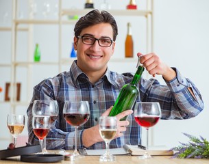 Professional sommelier tasting red wine