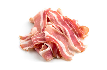 Slices of bacon on a white background. Raw bacon closeup on a white background.