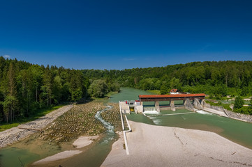 A sandbank in front of the isar river and a weir, shot by a drone.