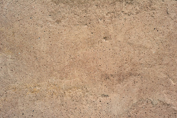 Texture of a concrete wall with cracks and scratches which can be used as a background
