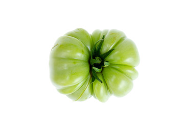 Green unripe tomato isolated on white background.