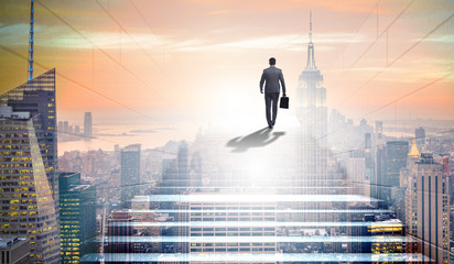 Businessman climbing up challenging career ladder in business co