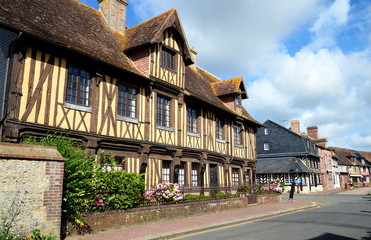 Beuvron-en-Auge, France - July 11, 2016: Beuvron is an achetpical small beautiful village in Normandy, France well-knowm by its half-timbered buildings.