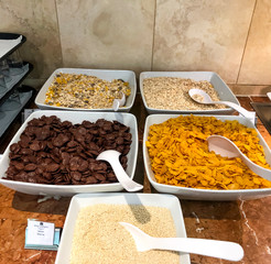 Set of various breakfast cereals for cooking with milk.