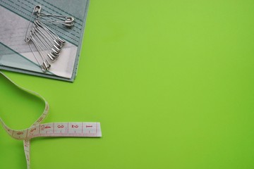 threads and needles on the background with patterns, accessories for cutting and sewing, womens hobby, tailoring