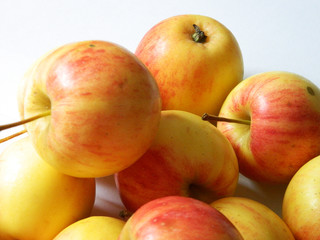 yellow apples on white background 