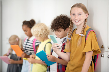 Children with tablets and smartphones playing video games