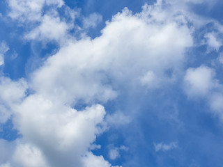 Big cloud floating in blue sky with copy space. Water droplets and ice crystals gathered together into clumps. Floating in the azure atmosphere