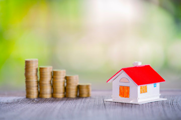 Coins stack for saving money and financial planning concept, saving to buy a house