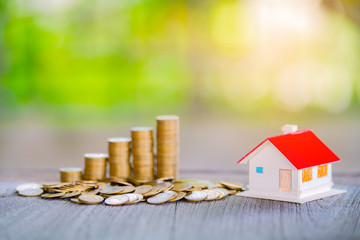 Coins stack for saving money and financial planning concept, saving to buy a house