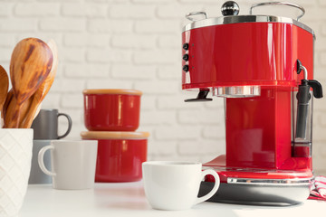 Modern kitchen. Red retro style coffee machine close up