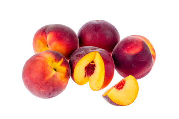 Several ripe sweet peaches isolated on white background.