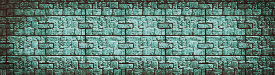 Teal stone wall wide texture. Patterned block retro background. Long vintage backdrop