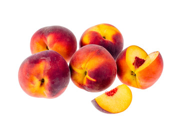 Several ripe sweet peaches isolated on white background.