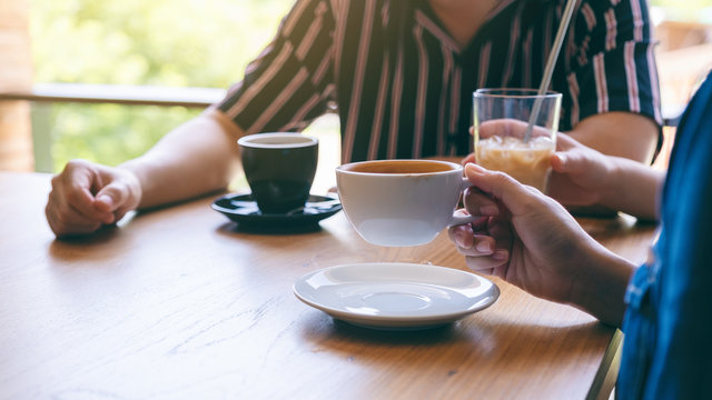 Closeup image of people enjoyed drinking coffee together