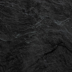 Dark grey black slate background or texture. black stone