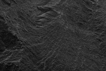 Dark grey black slate background or texture. black stone