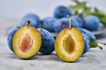 Raw organic plums in a on a vintage background