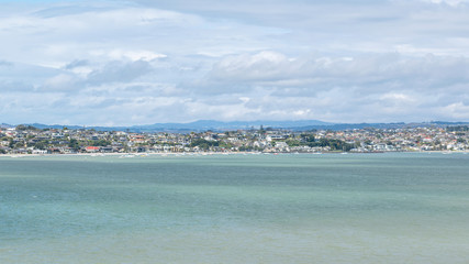 Panoramic view of Bucklands Beach waterfront suburb with Tamaki river in foreground