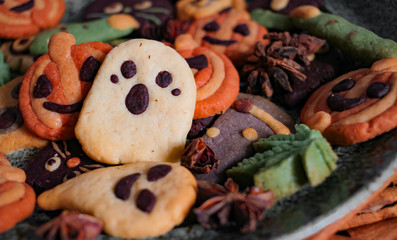 Halloween gingerbread cookies, pumpkin, ghost, skeleton for trick or treat Halloween party in October, homemade cookies with cinnamon spice and herb for autumn season