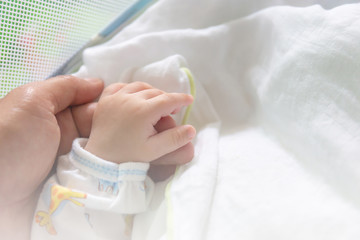 Selective focus of Father and son hand, Protection concept
