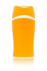 A blank orange sun cream bottle isolated on white background with fading reflection