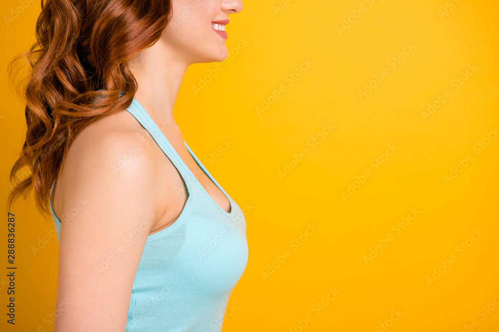 Sticker Cropped photo of cheerful nice girlfriend focused on her chest and boobs wearing turquoise tank-top while isolated over yellow vibrant color background