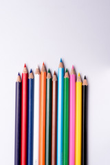 Color pencils arranged on a isolated white background.