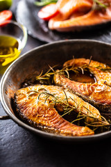 Salmon roasted steaks rosemary sal pepper olive oil - Close-up