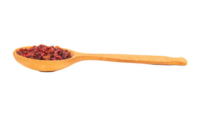 Dry barberry in spoon