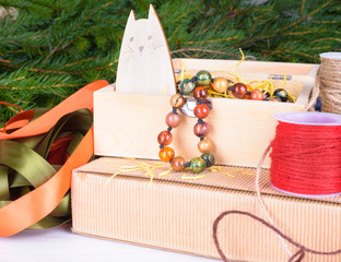 Christmas gift and package items - christmas tree branches, cord, ribbons.