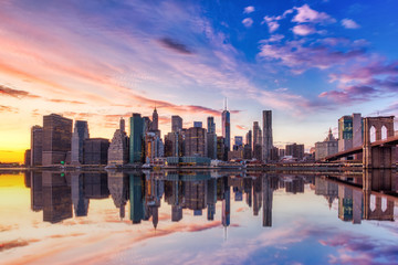 New York City Lower Manhattan with Brooklyn Bridge at Sunset