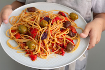spaghetti with tomato sauce and basil close up