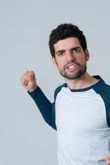 Fototapeta premium Handsome angry young man with furious face looking disgusted. Human expressions and emotions