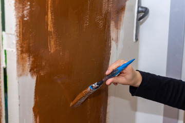 Painting a door at home.