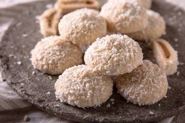 Coconut biscuit with caramel. Crispy and crumbly delicious cookies with natural ingredients: flour, nuts, seeds, pieces of chocolate, cocoa, fruit jams.