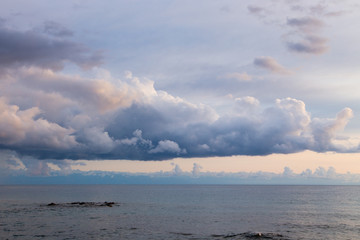 thundercloud. gloomy lake. bad weather, thunderstorm. Kyrgyzstan, Issyk-Kul Lake.