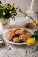 Biscuit hearts. Crispy and crumbly delicious cookies with natural ingredients: flour, nuts, seeds, pieces of chocolate, cocoa, fruit jams. Spring flower still life