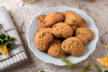 Biscuit hearts. Crispy and crumbly delicious cookies with natural ingredients: flour, nuts, seeds, pieces of chocolate, cocoa, fruit jams. Spring flower still life