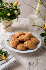 Biscuit hearts. Crispy and crumbly delicious cookies with natural ingredients: flour, nuts, seeds, pieces of chocolate, cocoa, fruit jams. Spring flower still life