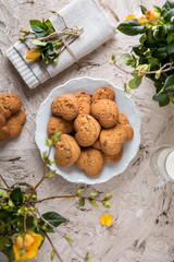 Biscuit hearts. Crispy and crumbly delicious cookies with natural ingredients: flour, nuts, seeds, pieces of chocolate, cocoa, fruit jams. Spring flower still life