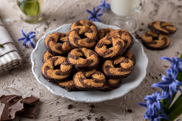 Сhocolate nut biscuit. Crispy and crumbly delicious cookies with natural ingredients: flour, nuts, seeds, pieces of chocolate, cocoa, fruit jams.